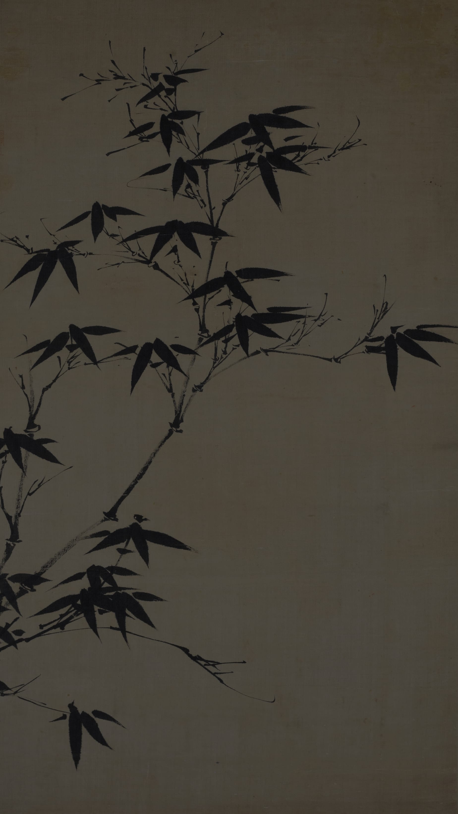 Vertical iPhone background from a Korean painting: ink bamboo branches arching diagonally across pale cream silk, sharp dark leaves, spare and minimal East Asian monochrome brushwork