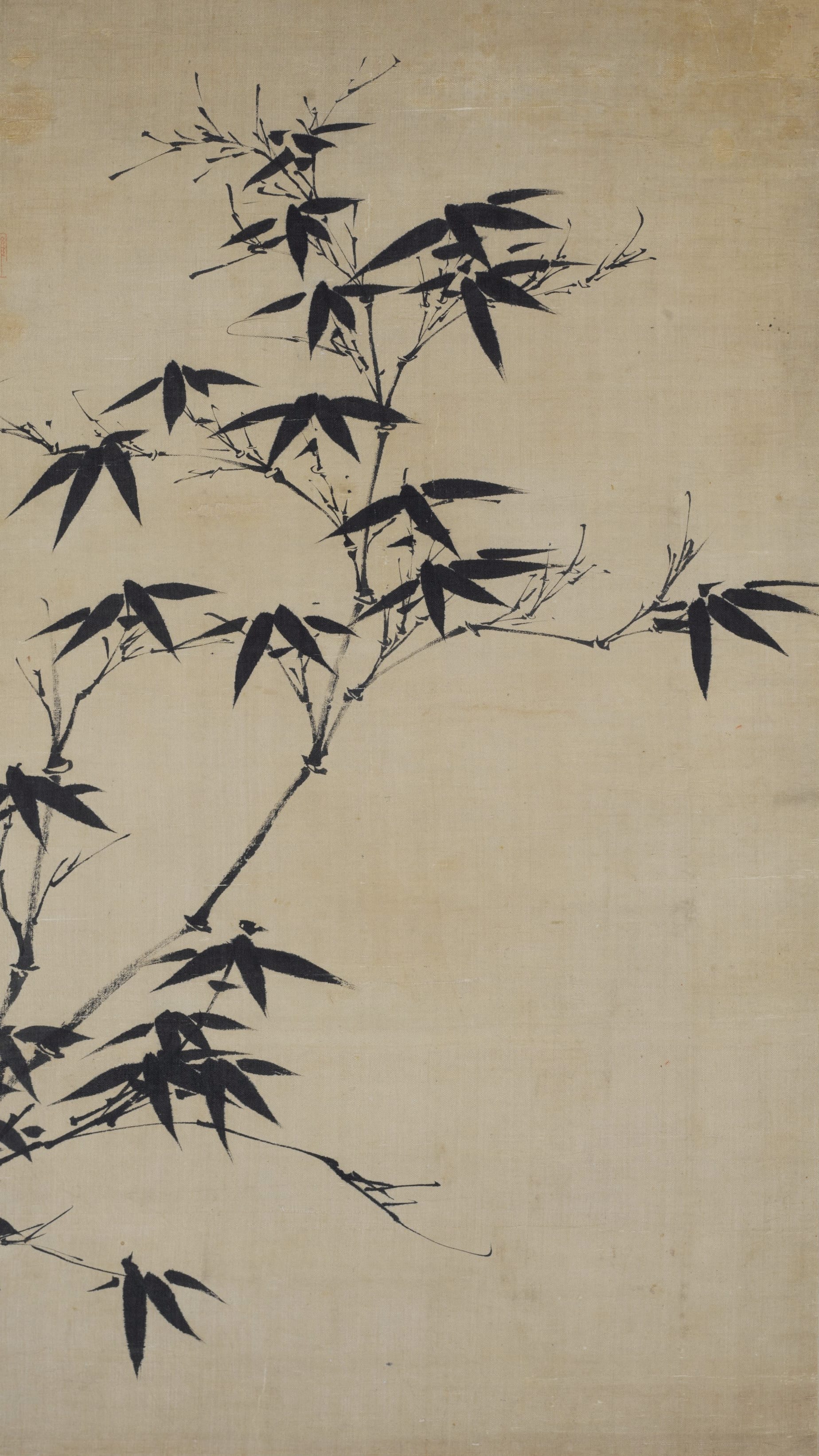 Vertical iPhone background from a Korean painting: ink bamboo branches arching diagonally across pale cream silk, sharp dark leaves, spare and minimal East Asian monochrome brushwork