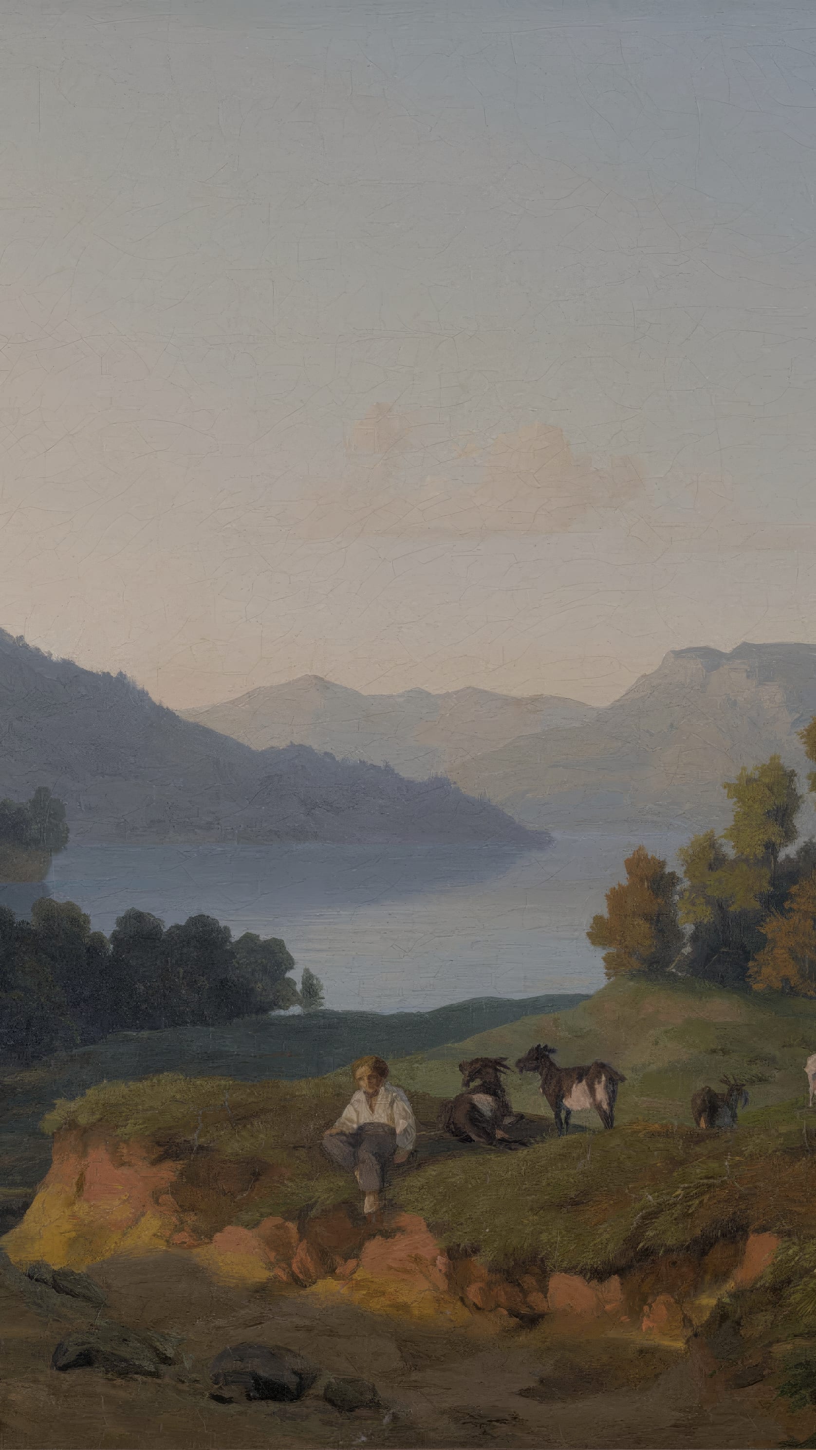 Vertical iPhone background from a painting: a pale evening sky over a long blue mountain lake, wooded ridges folding back into haze, and on the near bank a boy sitting in the grass beside two goats