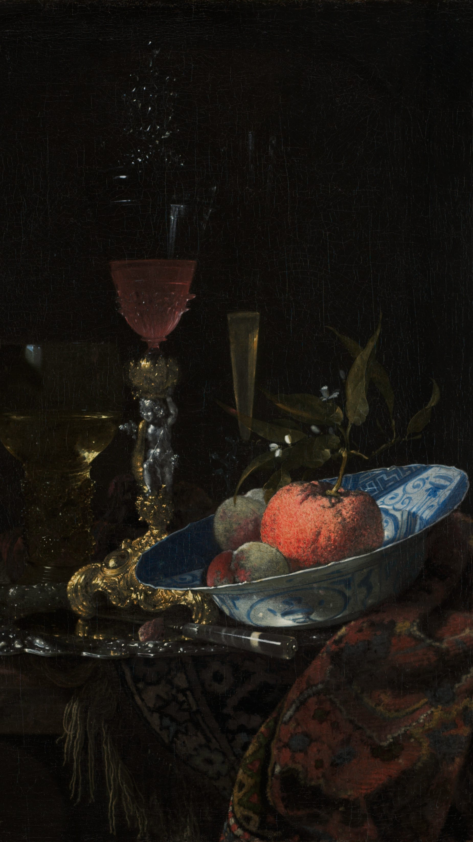Dark academia vertical iPhone background from a painting: a glass of rose wine beside a nautilus shell mounted in gold, a blue-and-white porcelain bowl with a peach and an orange on a silver platter, dark background