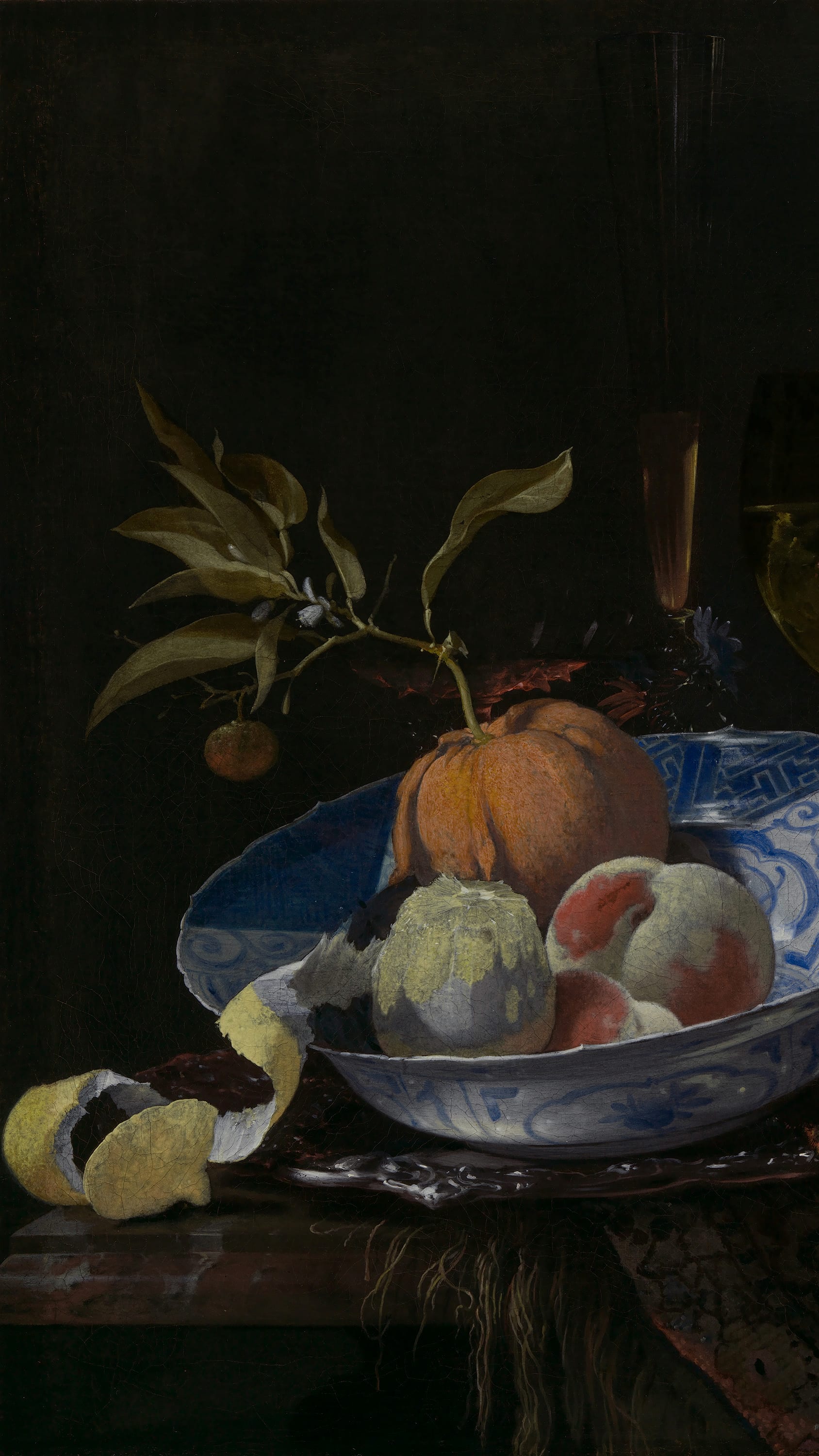 Dark academia vertical iPhone background from a painting: a blue-and-white porcelain bowl of peaches and a split pomegranate beside a wine glass, a lemon peeled in a long spiral draped over the table's edge