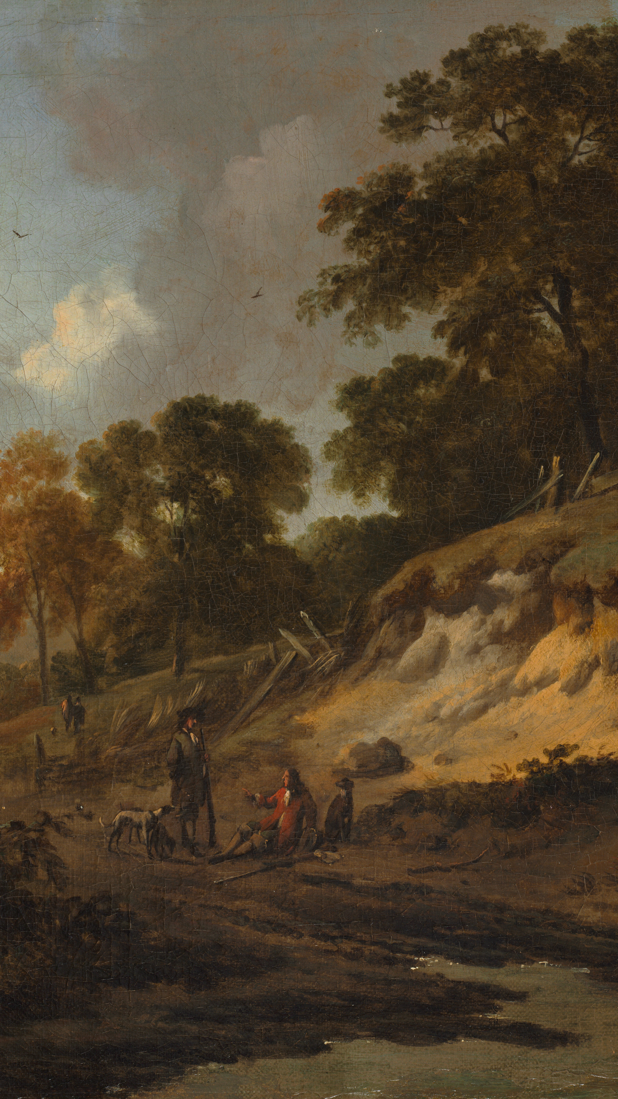 Dark academia vertical iPhone background from a painting: hunters with hounds on a rutted road beside a sandy embankment, dark autumn trees, warm golden light on a broad valley
