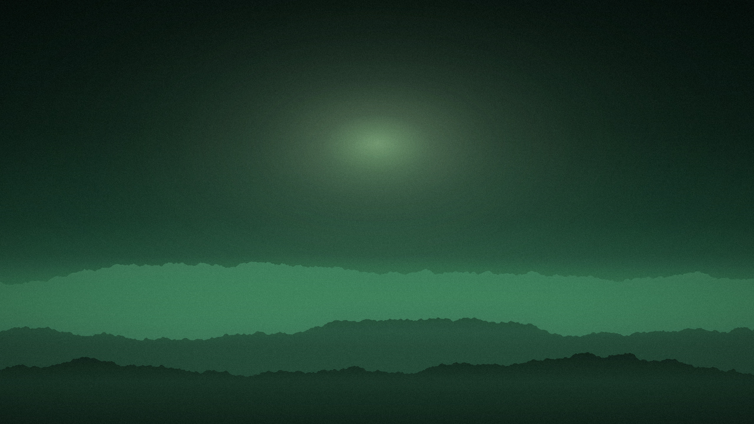 Green desktop wallpaper: layered treelines in fog under a green sky, a wide soft glow with no visible source