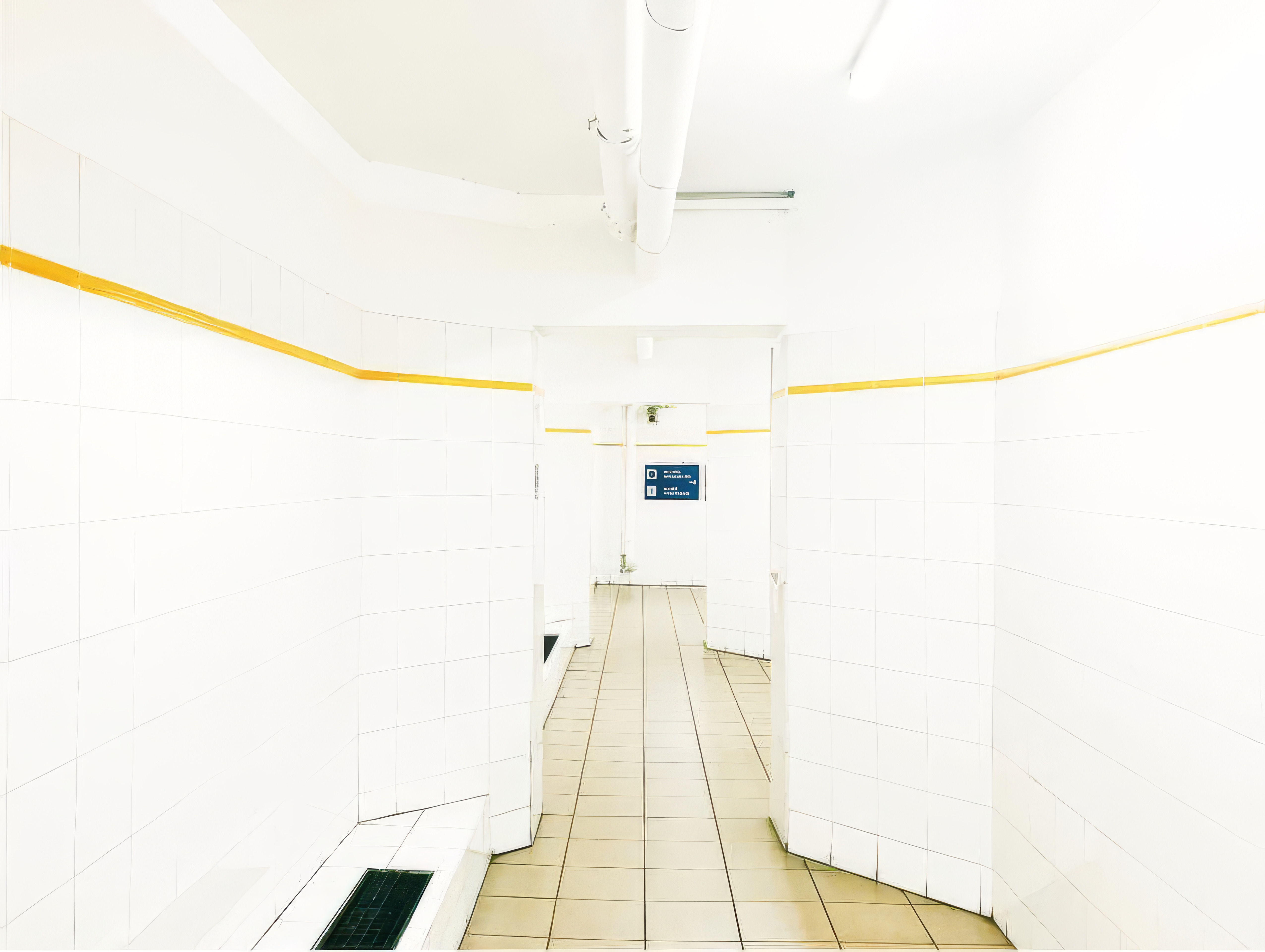 Desktop wallpaper photo: a stark white hallway with a wooden floor, converging in one-point perspective